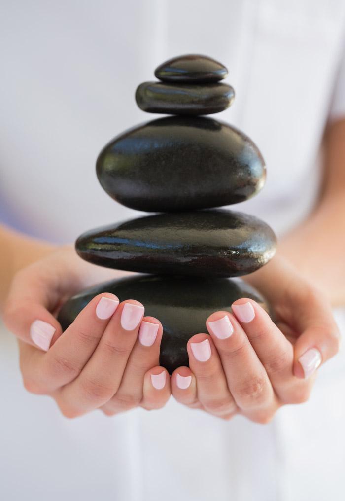 A person holding rocks in their hands