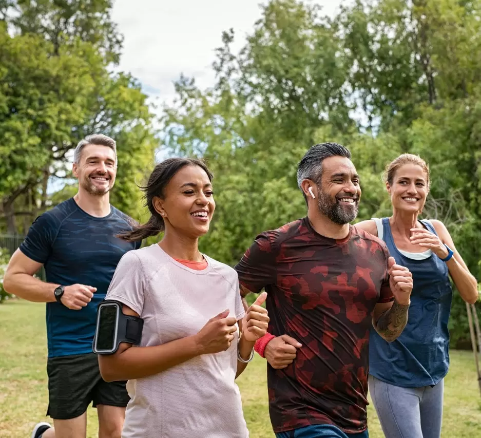 A group of people running in the park