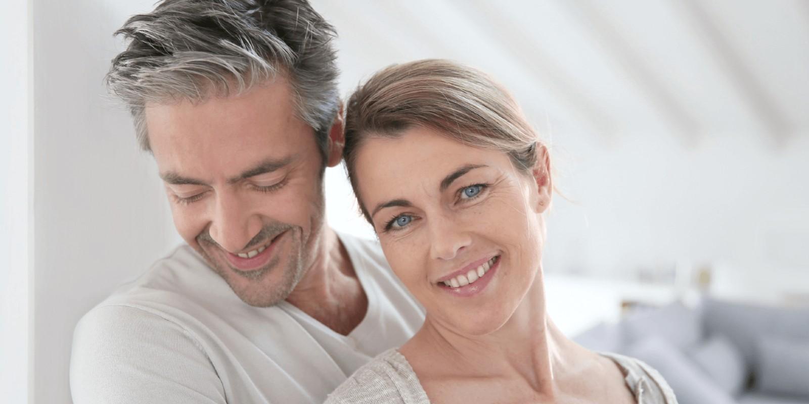 A man and woman smiling for the camera.