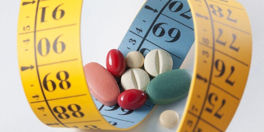 A close up of pills on a scale